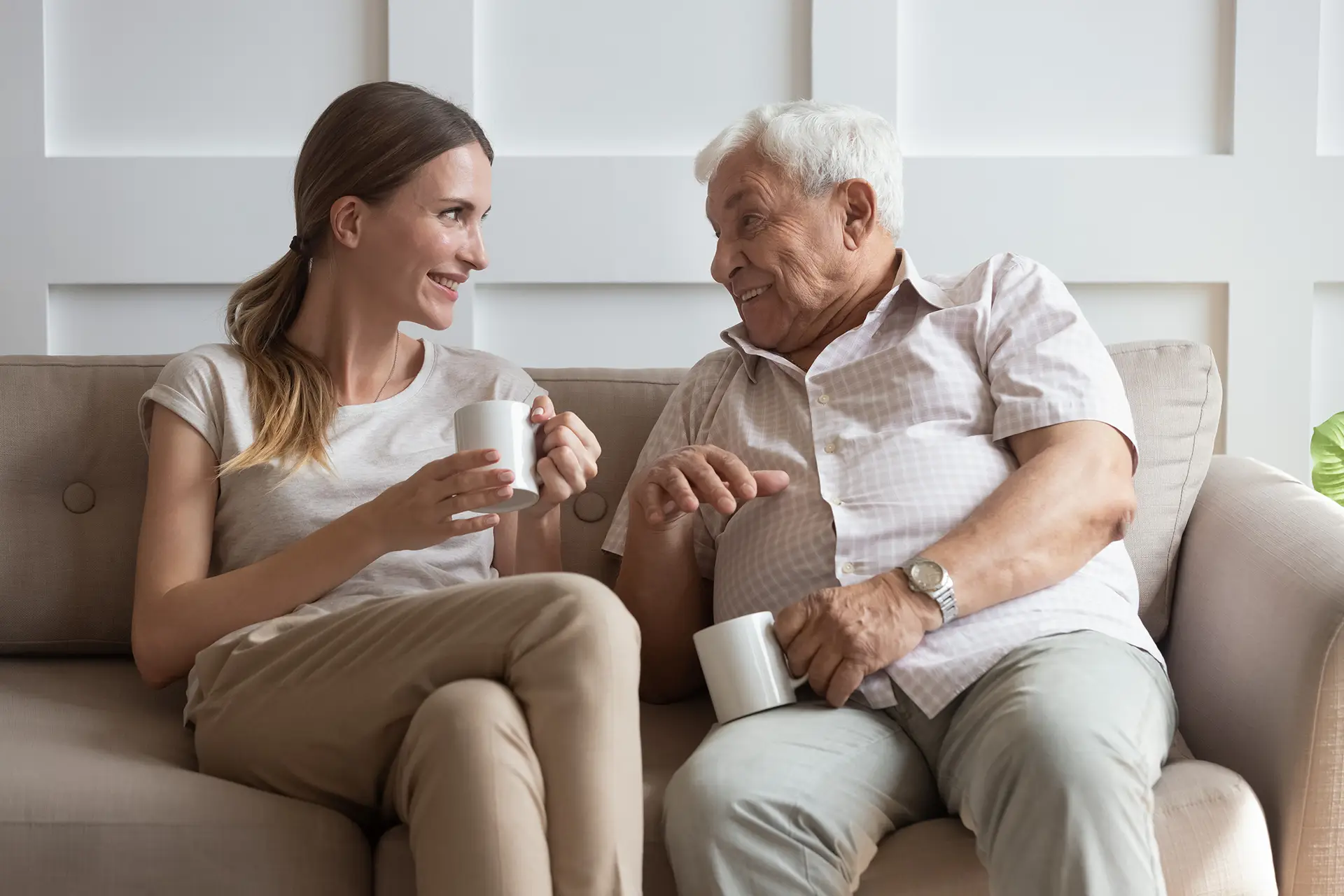 Senior father and his adult daughter talking